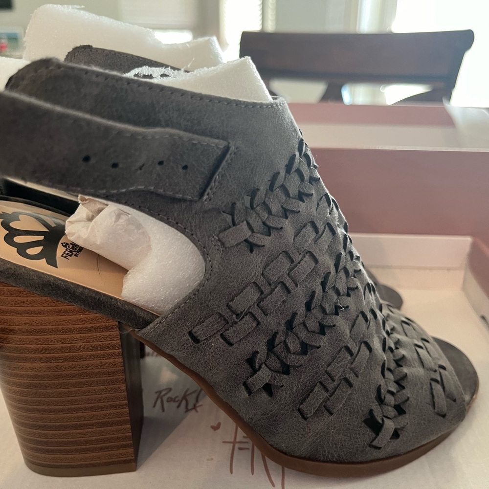 New in box. Fergalicious faux grew leather strapped heel sandals. Size 8.5